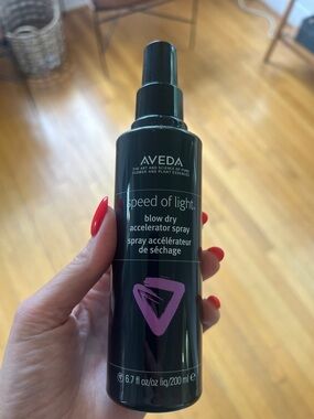 AVEDA black bottle with pink graphic blow dry accelerator spray
